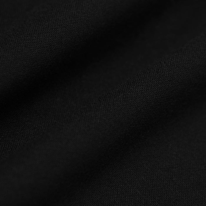 Black Tall Active Crew Neck 2.0, showcasing fine woven texture and gentle folds.
