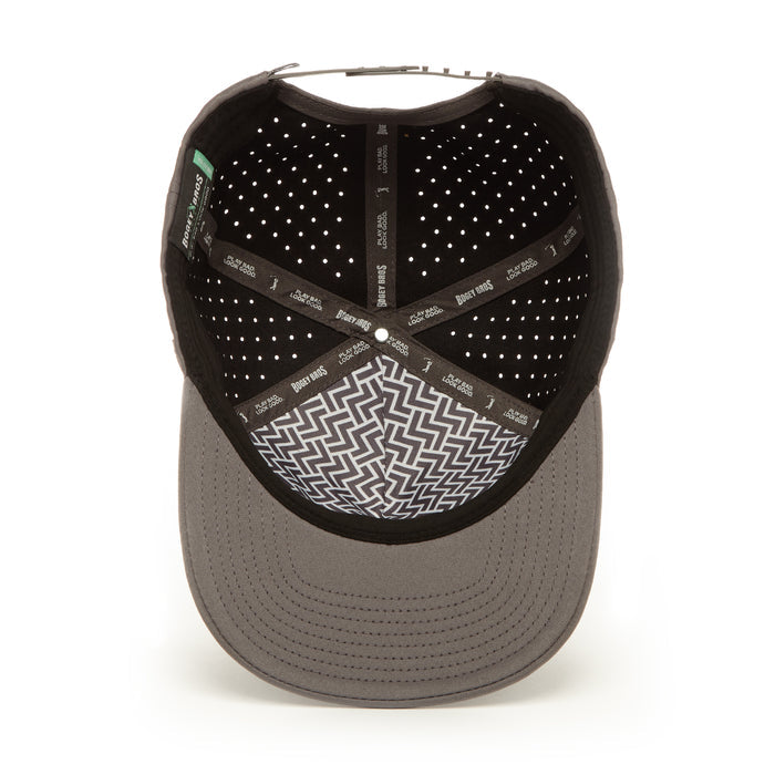 Inside view of the Bogeyman Charcoal Performance Golf Hat Snapback shows perforated lining, a zigzag-patterned sweatband, crossed inner bands labeled "Benny Gold," a gray brim, and visible interior stitching.
