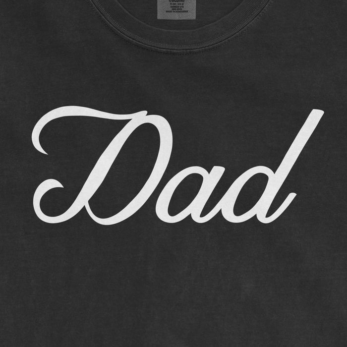 Black Comfort Colors tee with white "Dad" text, designed for Bronx baseball dads.