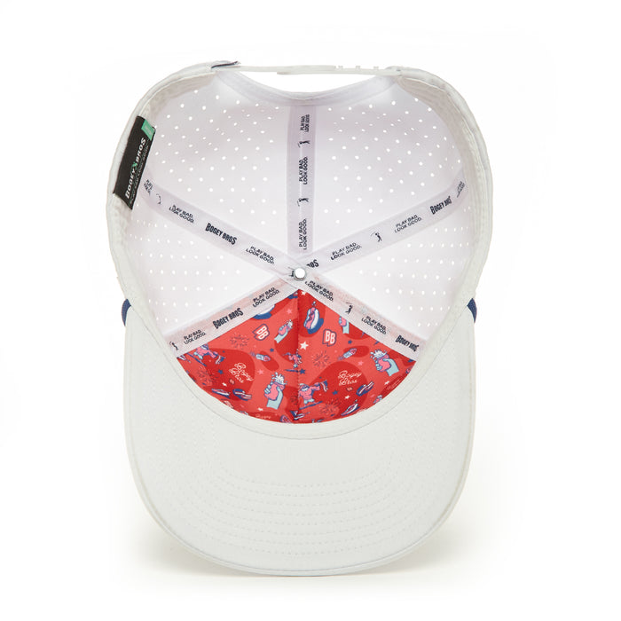 A top-down view of the 'Merica - Performance Golf Hat - Snapback reveals a white sweatband with black Disney Pixar and BEAMS logos, plus a bright red front interior featuring blue and white Monsters, Inc. cartoon characters.