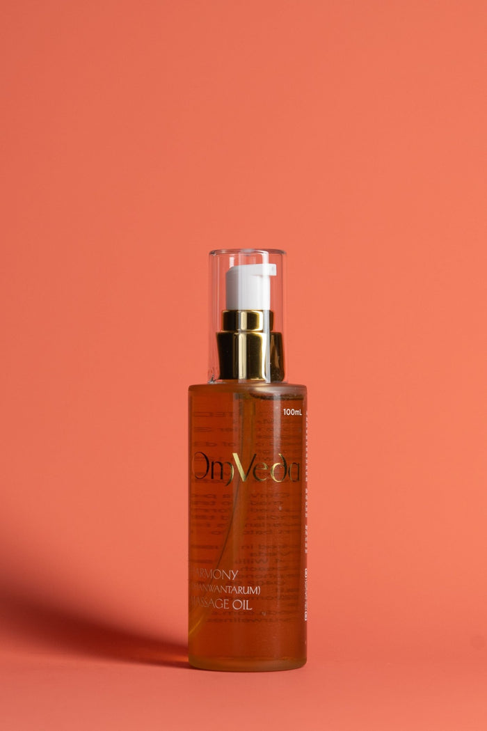 Harmony body oil 100 ml bottle with gold pump and amber liquid