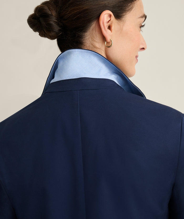 Model is wearing UNTUCKit Piper blazer in navy.