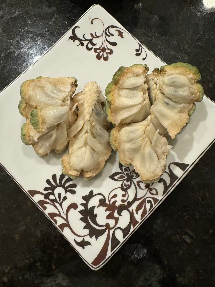 Harvested Sugar Apple fruit on a patterned plate