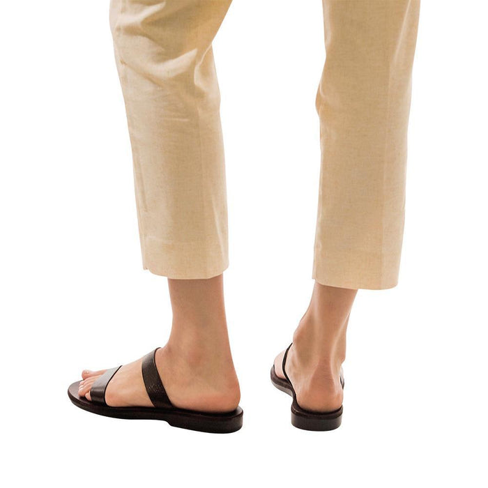 Model wearing Ada brown, handmade leather slide sandals