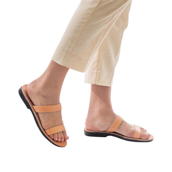 Model wearing Ada tan, handmade leather slide sandals