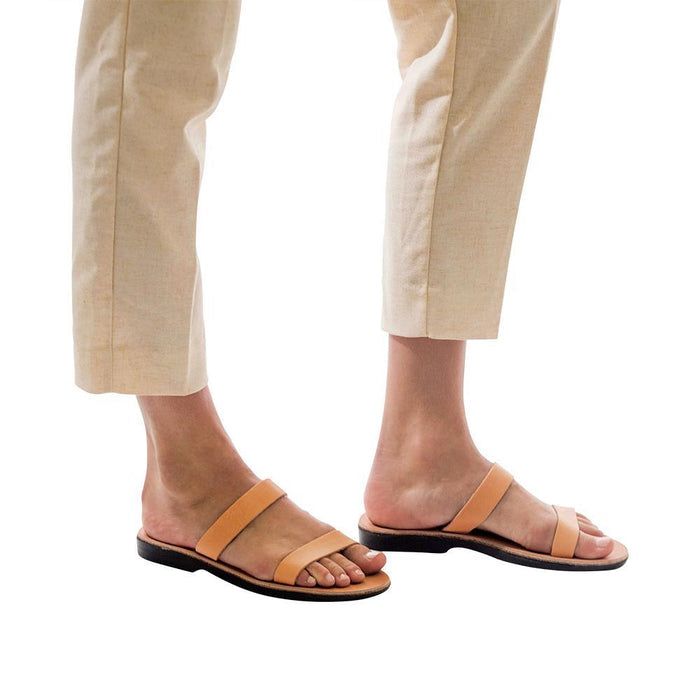 Model wearing Ada tan, handmade leather slide sandals