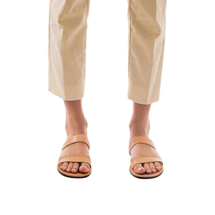 Model wearing Ada tan, handmade leather slide sandals