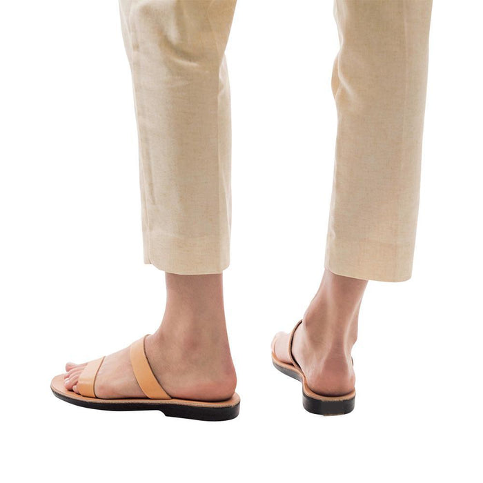 Model wearing Ada tan, handmade leather slide sandals