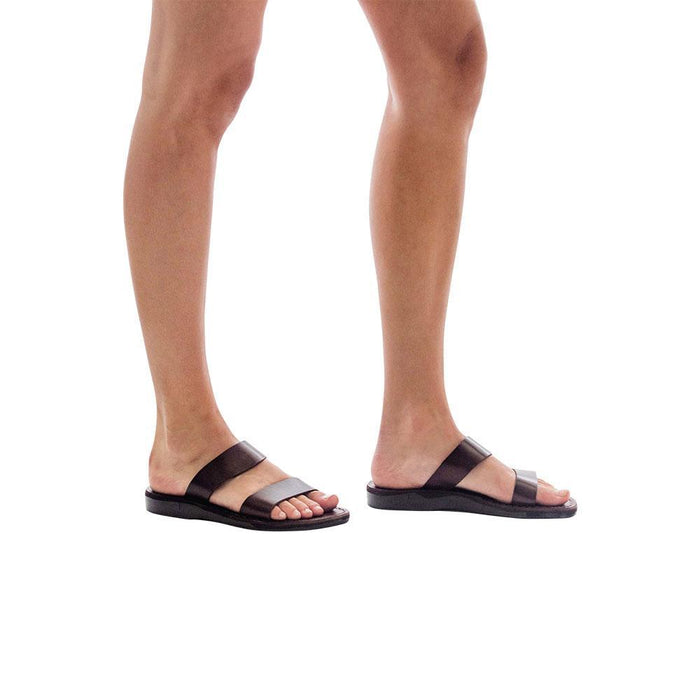 Model wearing Aviv brown, handmade leather slide sandals