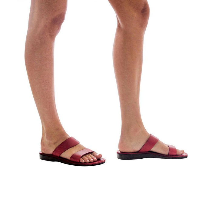 Model wearing Aviv red, handmade leather slide sandals