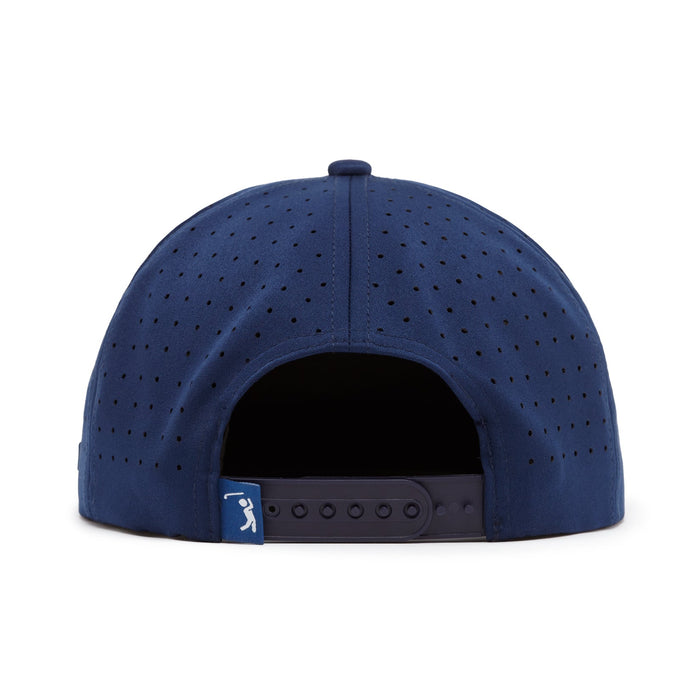 The Bogeyman Stamp Navy Unstructured Flat Bill Hat is a navy snapback cap made from performance material with ventilation holes, an adjustable closure, and a strap tag featuring a white bat-swinging silhouette.