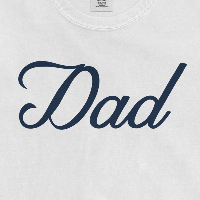 White Comfort Colors T-shirt with navy "Dad" text in cursive font, designed for Bronx baseball dads.