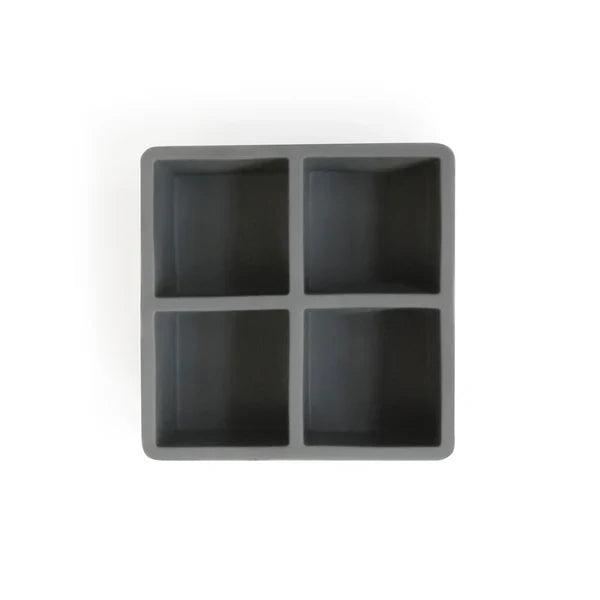 A gray Cocktail Kingdom flexible ice cube tray with four square forms.