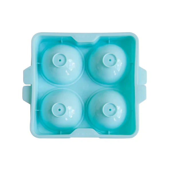 A blue ice sphere tray filled with four spherical ice molds for cocktails on white background.