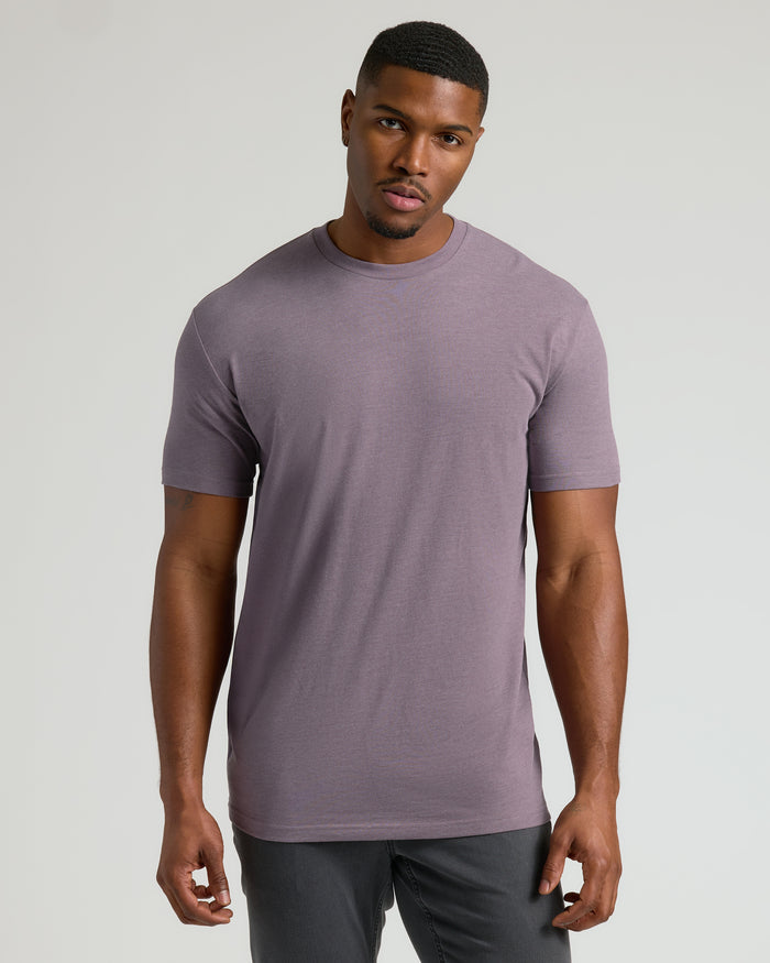 Man wearing Dark Heather Amethyst Tall Crew Neck T-Shirt, straight hem.
