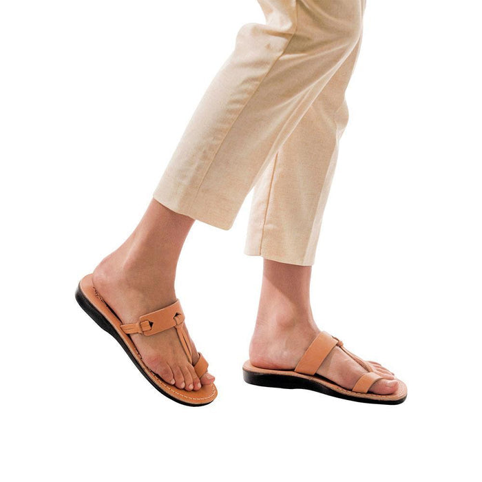 Model wearing David tan, handmade leather slide sandals with toe loop