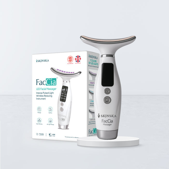 Skinska FacCia LED facial massager with packaging on a light gray background