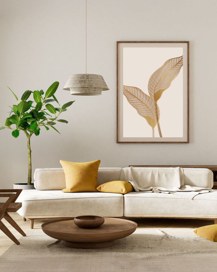 A leafy green houseplant in a sleek white planter, styled in a warm, minimalist modern living room with a textured white sofa