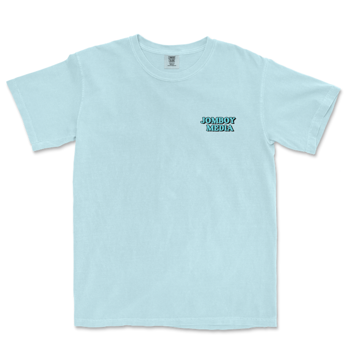 Light blue Comfort Colors T-shirt with "JOMBOY MEDIA" logo in black and blue on the front left chest area.