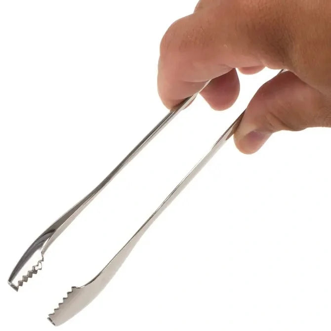 Hand holding a pair of metal tongs against a white background