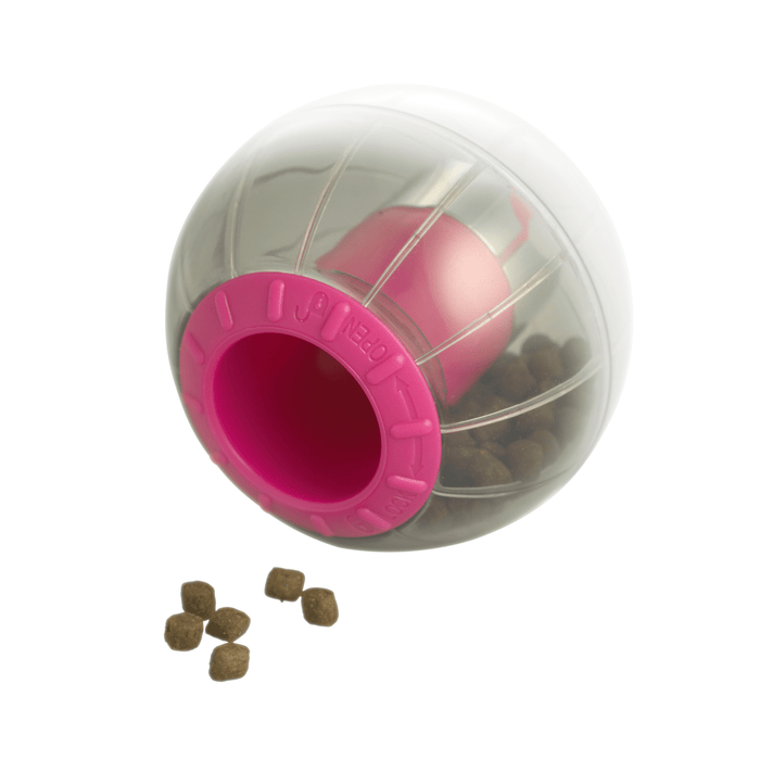 White background with a Kruuse Catmosphere treat dispenser, with a pink trim and transparent body with cat treats visible inside.