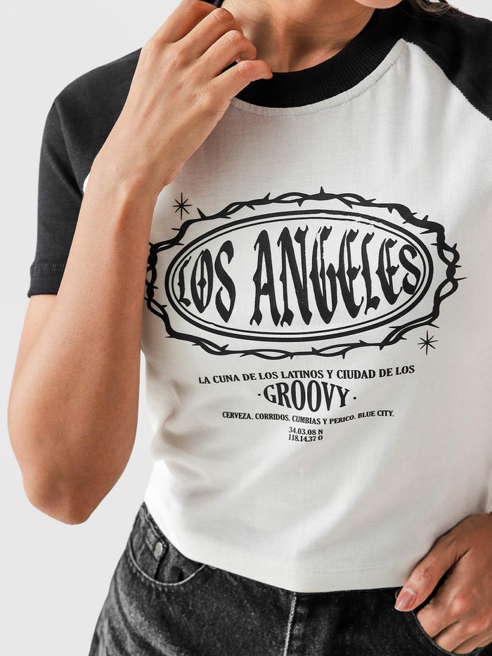 LA baby tee female model full body front view bold black graphic Pakistan – GROOVY