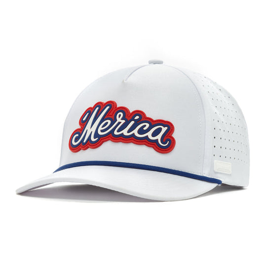 The 'Merica - Performance Golf Hat - Snapback is a white cap made of performance material with side perforations, blue bill trim, bold cursive "Merica" in blue with red outline, and a structured snapback design with a top button.