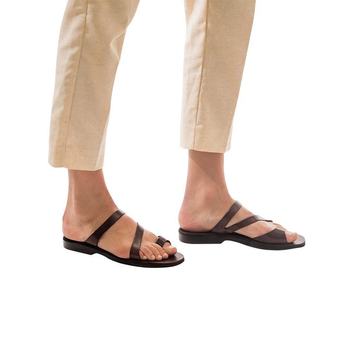 Model wearing Noah brown, handmade leather slide sandals with toe loop