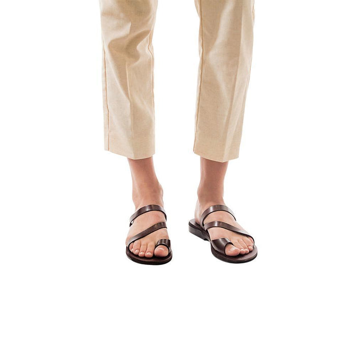 Model wearing Noah brown, handmade leather slide sandals with toe loop