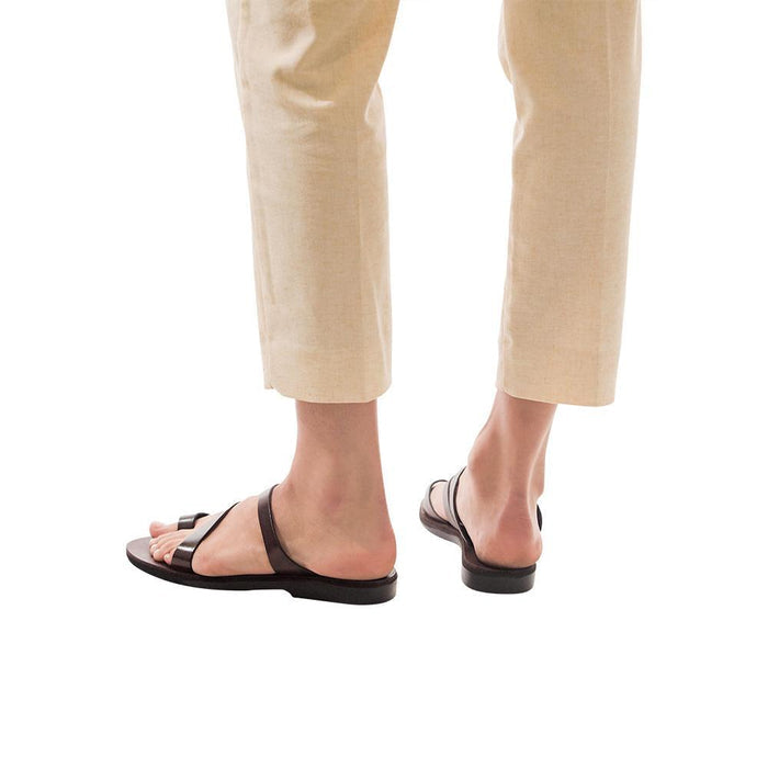 Model wearing Noah brown, handmade leather slide sandals with toe loop