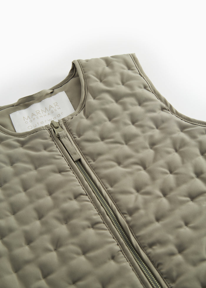 Green quilted vest with pockets for children