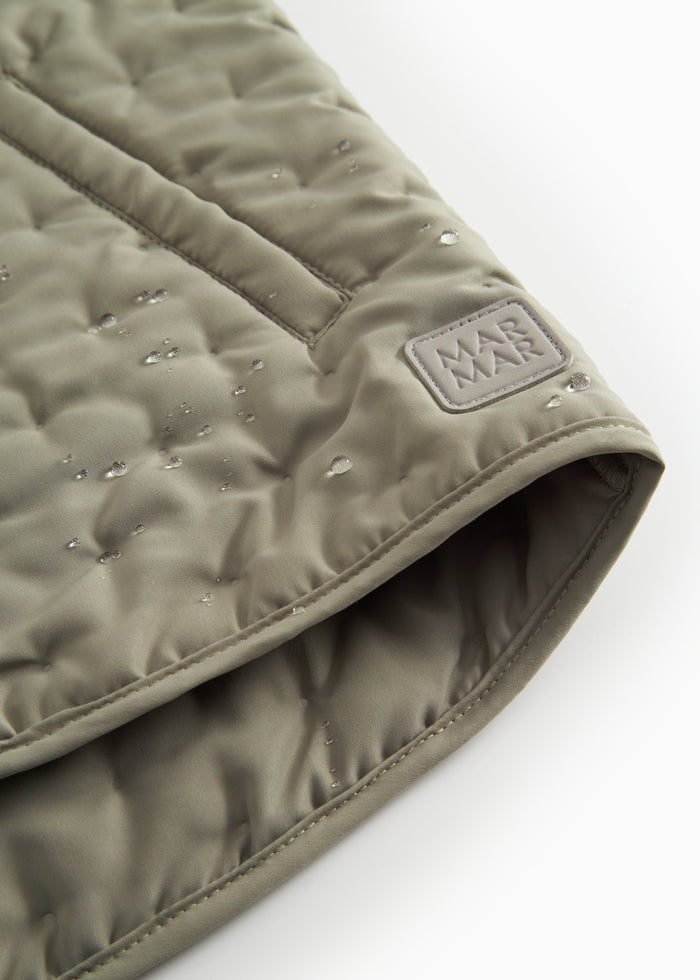 Green quilted vest with pockets for children