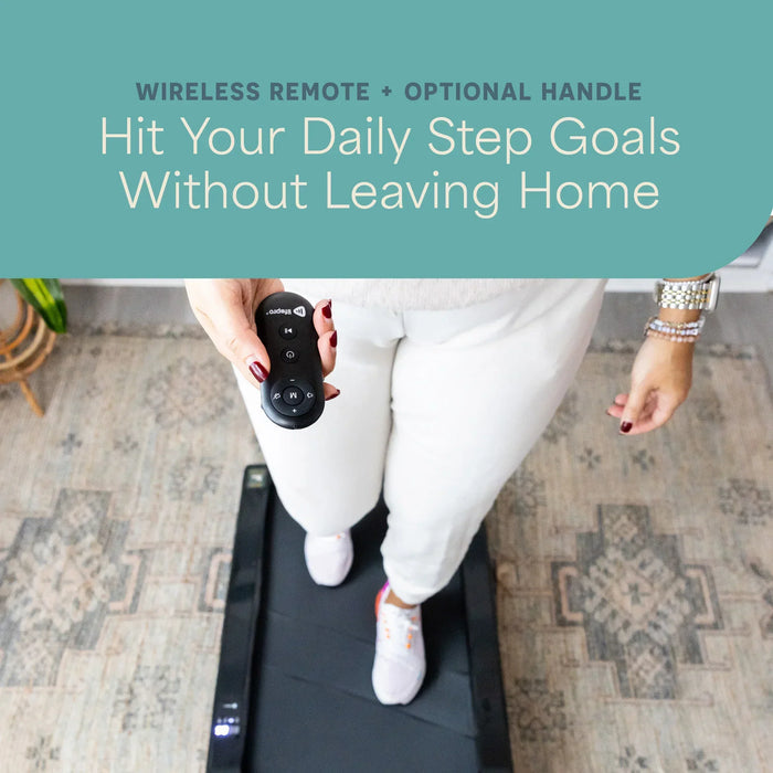 Overhead view of a woman's feet on the PacerMini treadmill belt while she holds its wireless remote, with text reading Wireless Remote plus Optional Handle, Hit Your Daily Step Goals Without Leaving Home.