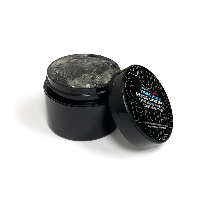 Black jar with open lid containing a gray substance, on a white background