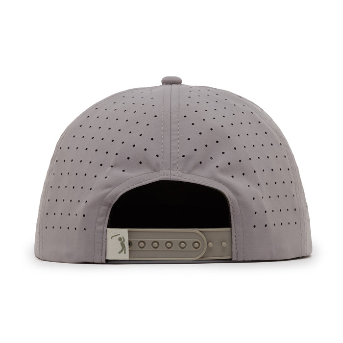 The Revoked Unstructured Flat Bill Snapback Hat in light gray is shown from the back, with ventilation holes, an adjustable snapback closure, and a small logo tag on the left side of the closure.