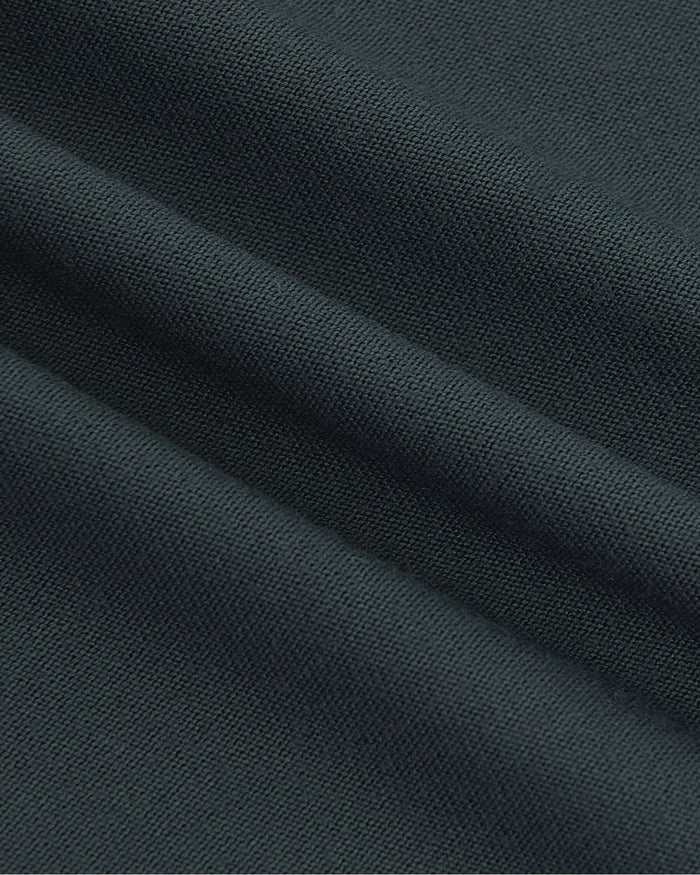 Close-up of dark blue fabric with visible texture