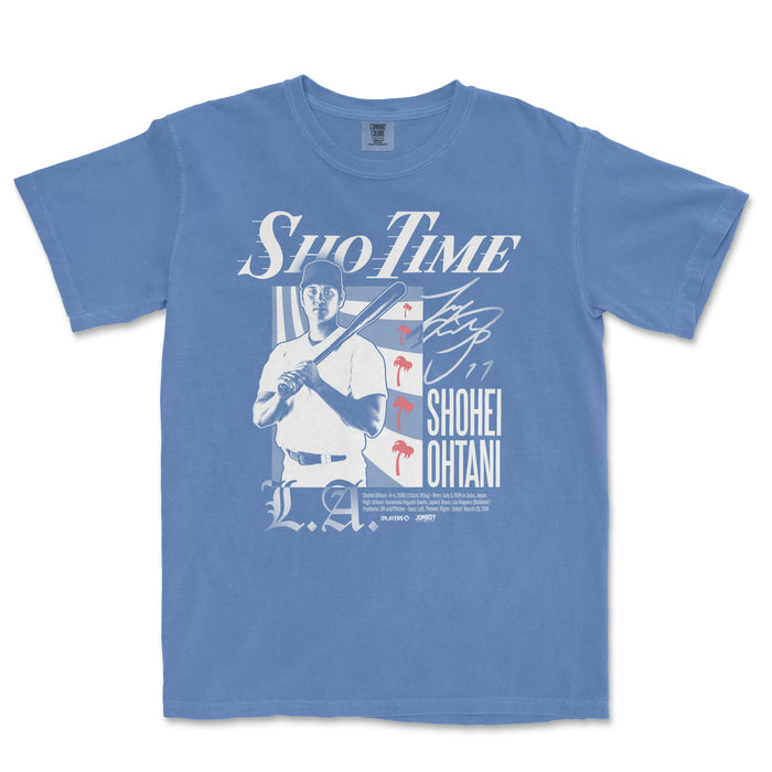 Blue T-shirt featuring a graphic of Shohei Ohtani holding a baseball bat, with "Sho-Time" text and red flamingo accents.