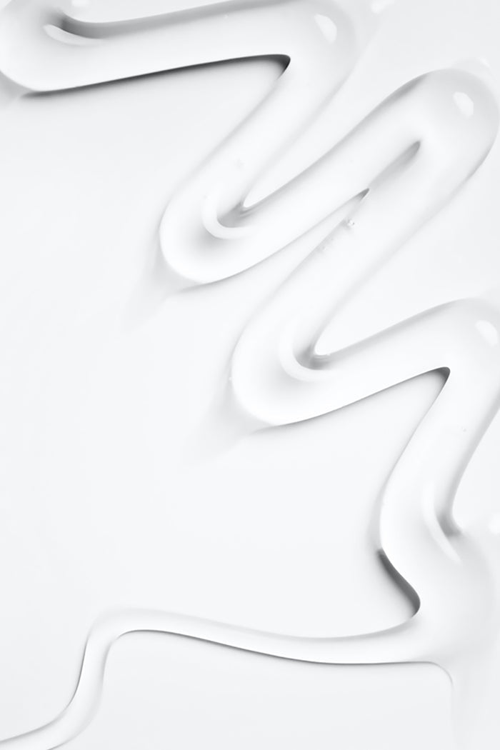 squiggle of hand wash goop on white grey background