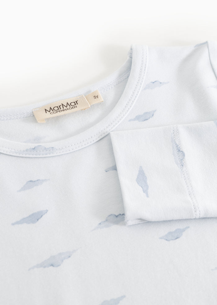 Baby nightgown close: round neck and whale pattern, label on the top.