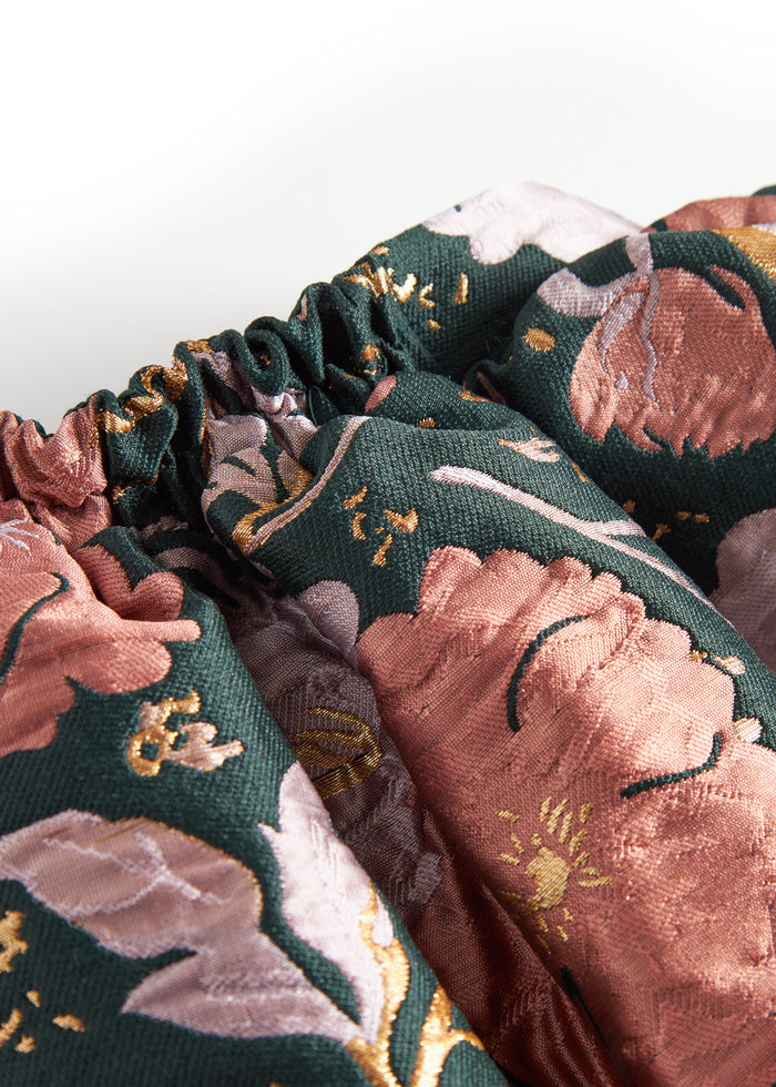 Short dark green skirt with large flowers and bow detail for children