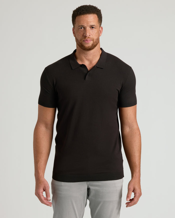 Man wearing Staple Tall Dressy Polo 6-Pack with light gray trousers.