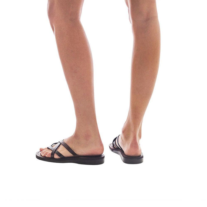 Model wearing Tamar brown, handmade leather slide sandals