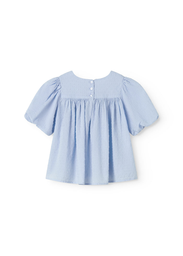 Short-sleeved blouse for children with puff sleeves and a fine embroidery pattern.