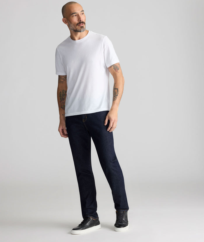 Model is wearing UNTUCKit Dark Wash Denim.