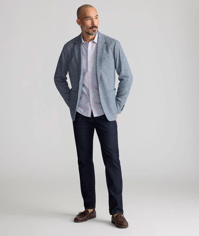 Model is wearing UNTUCKit Dark Wash Denim.