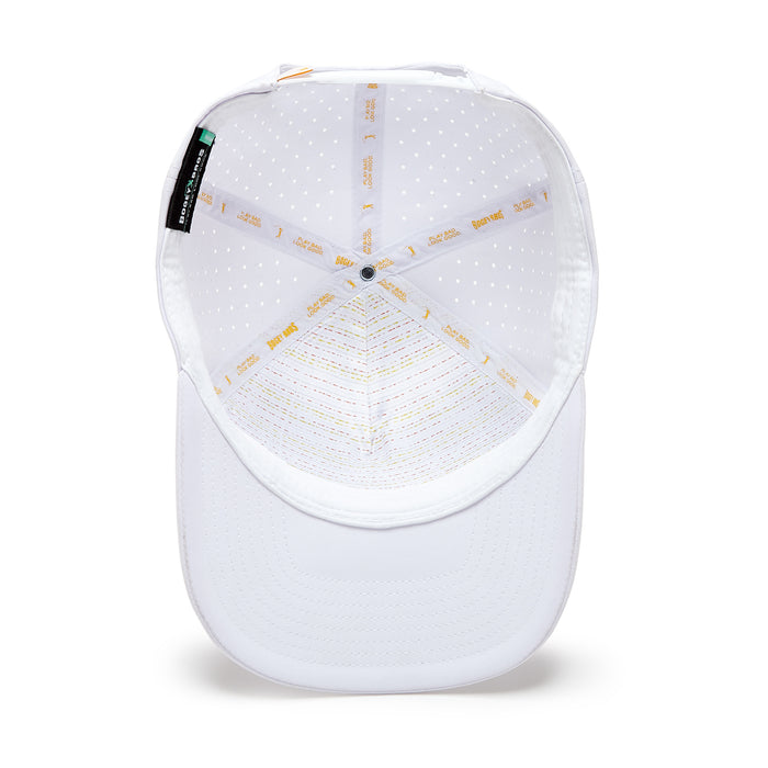 A top-down view of the White Hot - Performance Golf Hat - Snapback shows its sweat stain resistant material, curved brim, ventilation holes, gold text along the inner seams, and a black fabric tag attached inside.