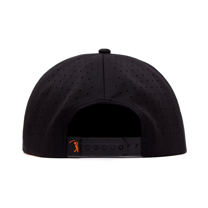 The Wingin' It Unstructured Flat Bill Hat - Snapback, shown from the back in black, features ventilation holes, a snapback strap with a small orange figure logo on the left, and is made from performance material. Background is plain white.
