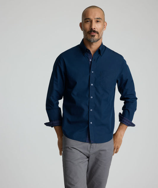 Model is wearing UNTUCKit Fonteplant shirt in navy.