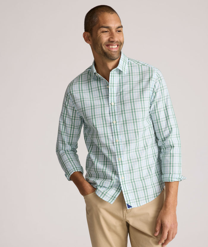 Model is wearing UNTUCKit Quigley wrinkle free shirt in check.