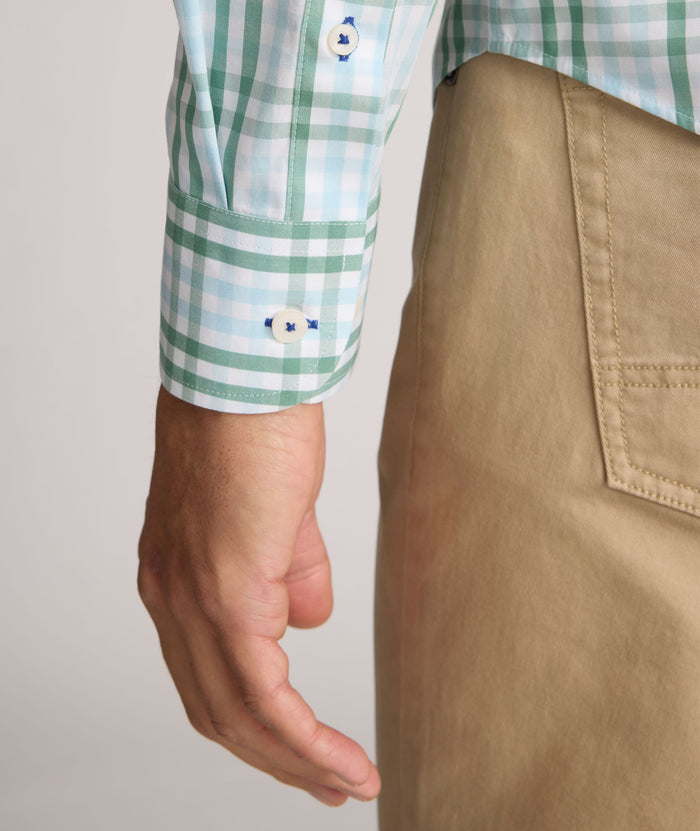 Model is wearing UNTUCKit Quigley wrinkle free shirt in check.